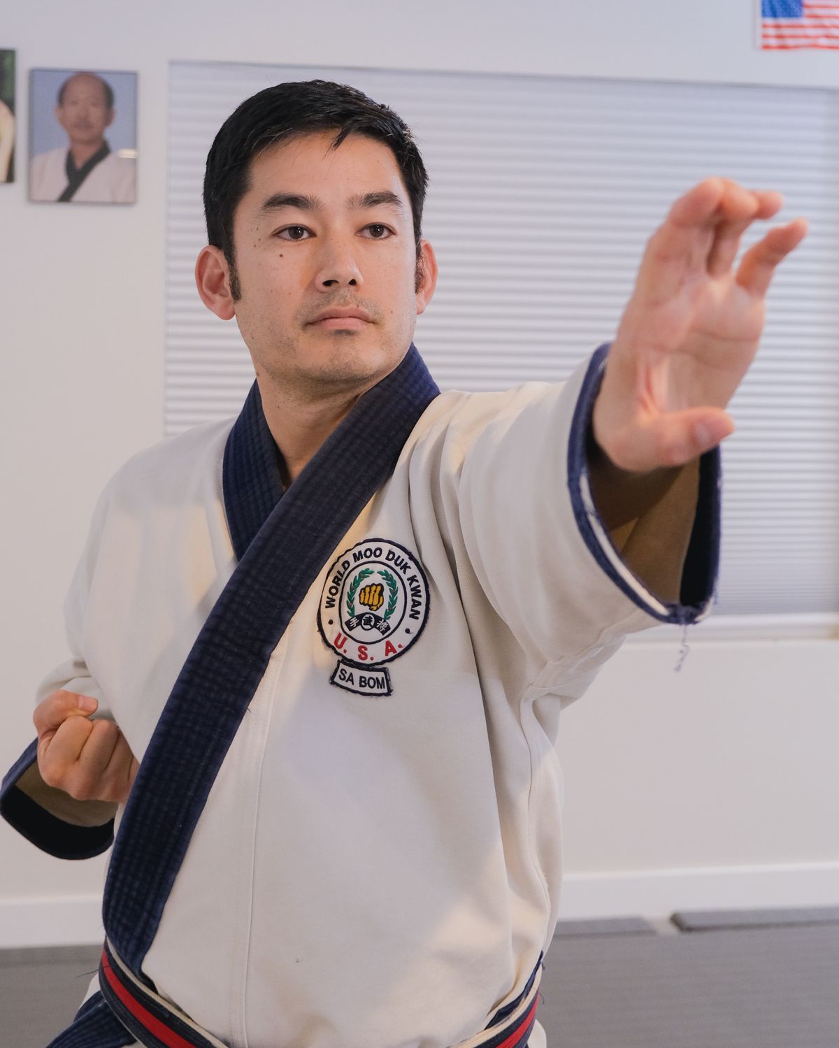 Brian Corrales, Sa Bom, extending an open-hand technique in the Wasatch Martial Arts Academy dojang