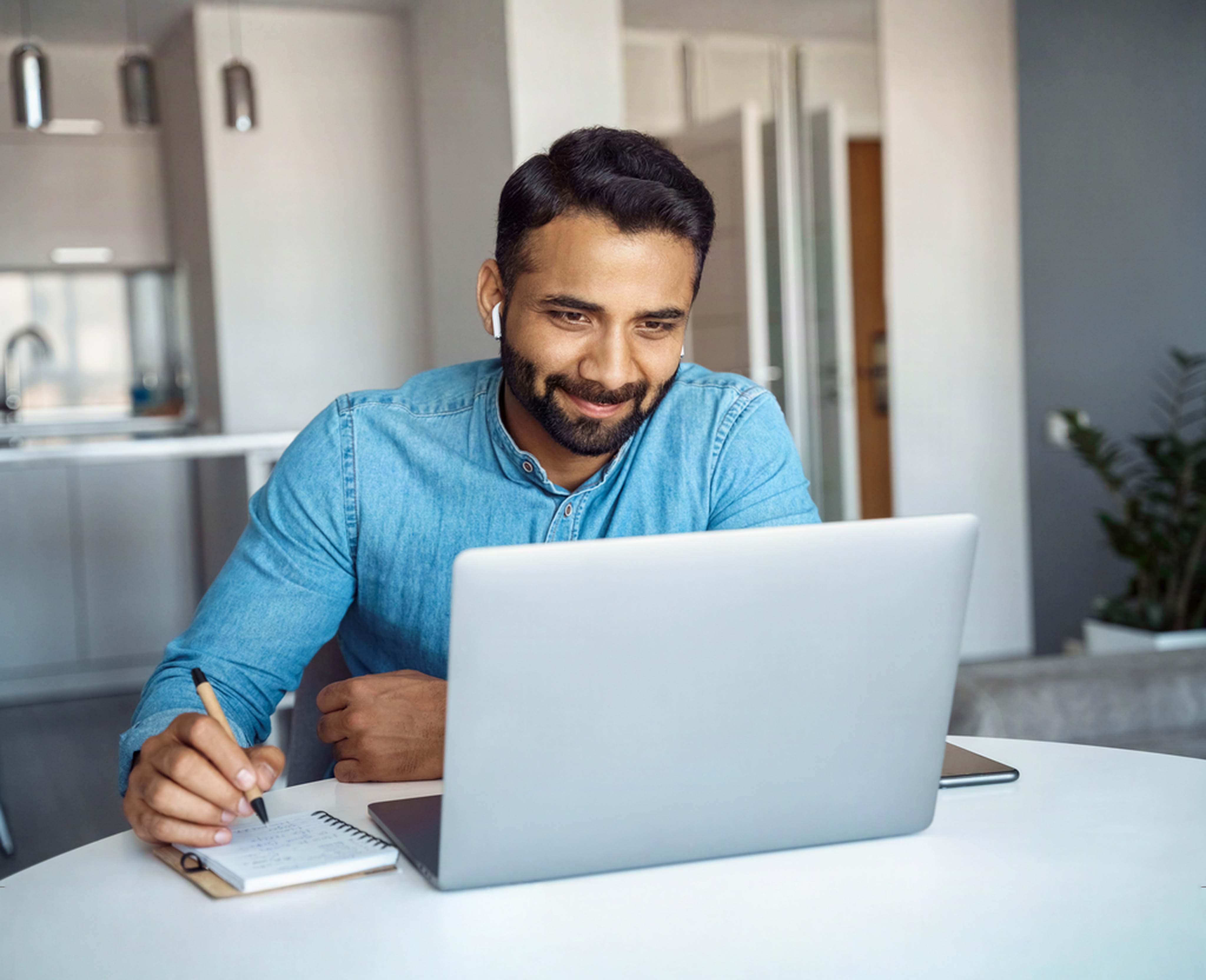 Student listening to online course at computer