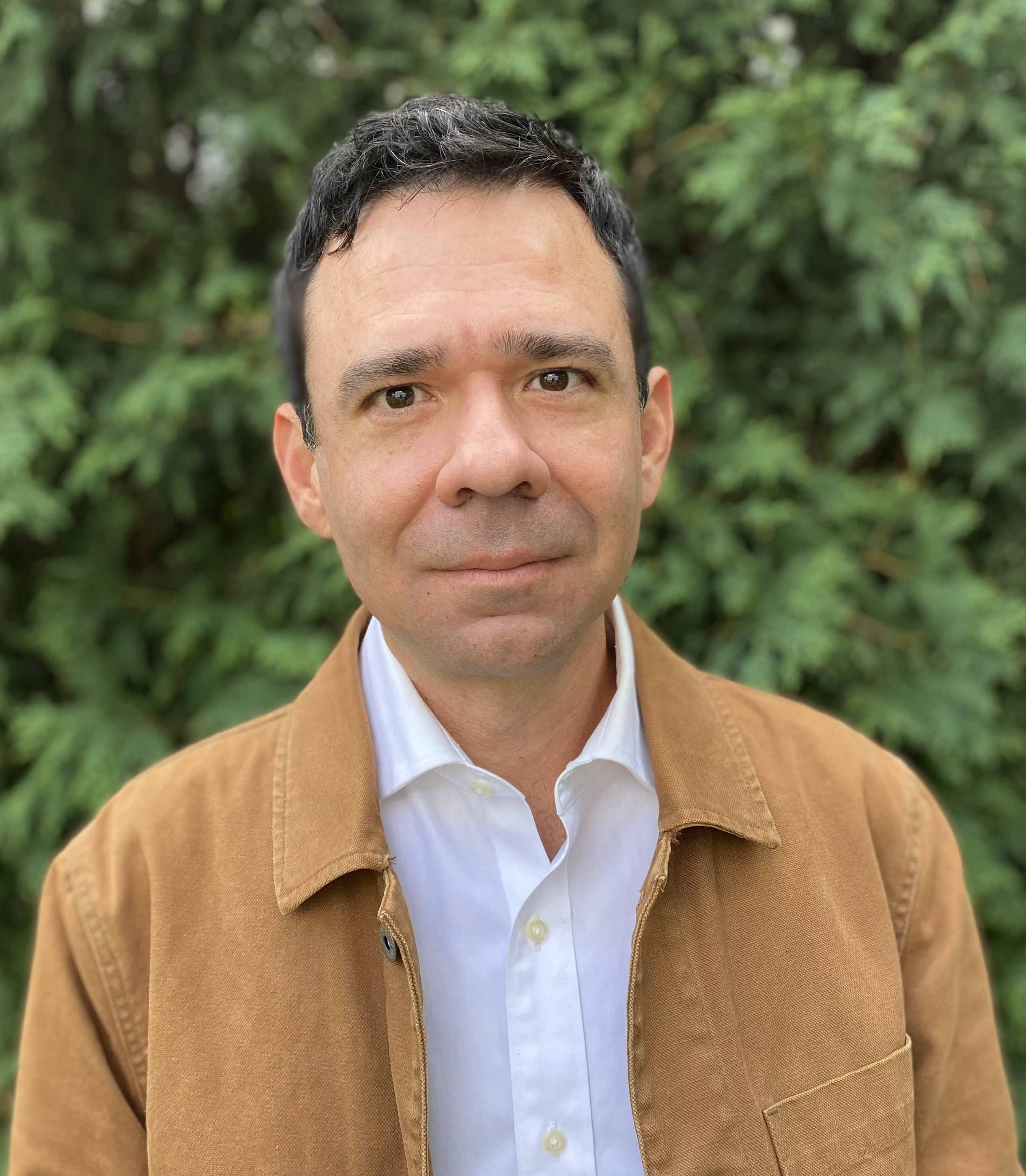 Smiling, author and teacher Juan Martinez