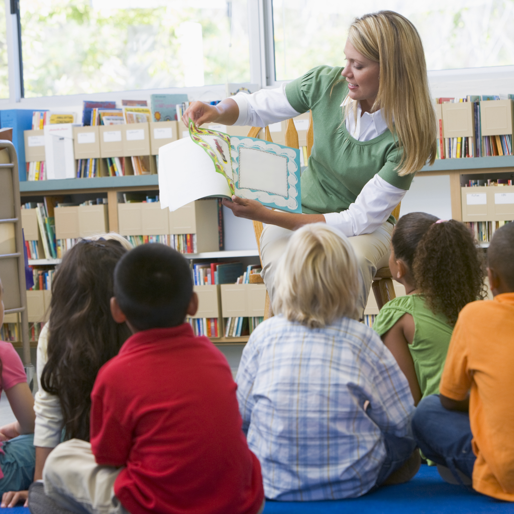teacher reading book to students, decorative