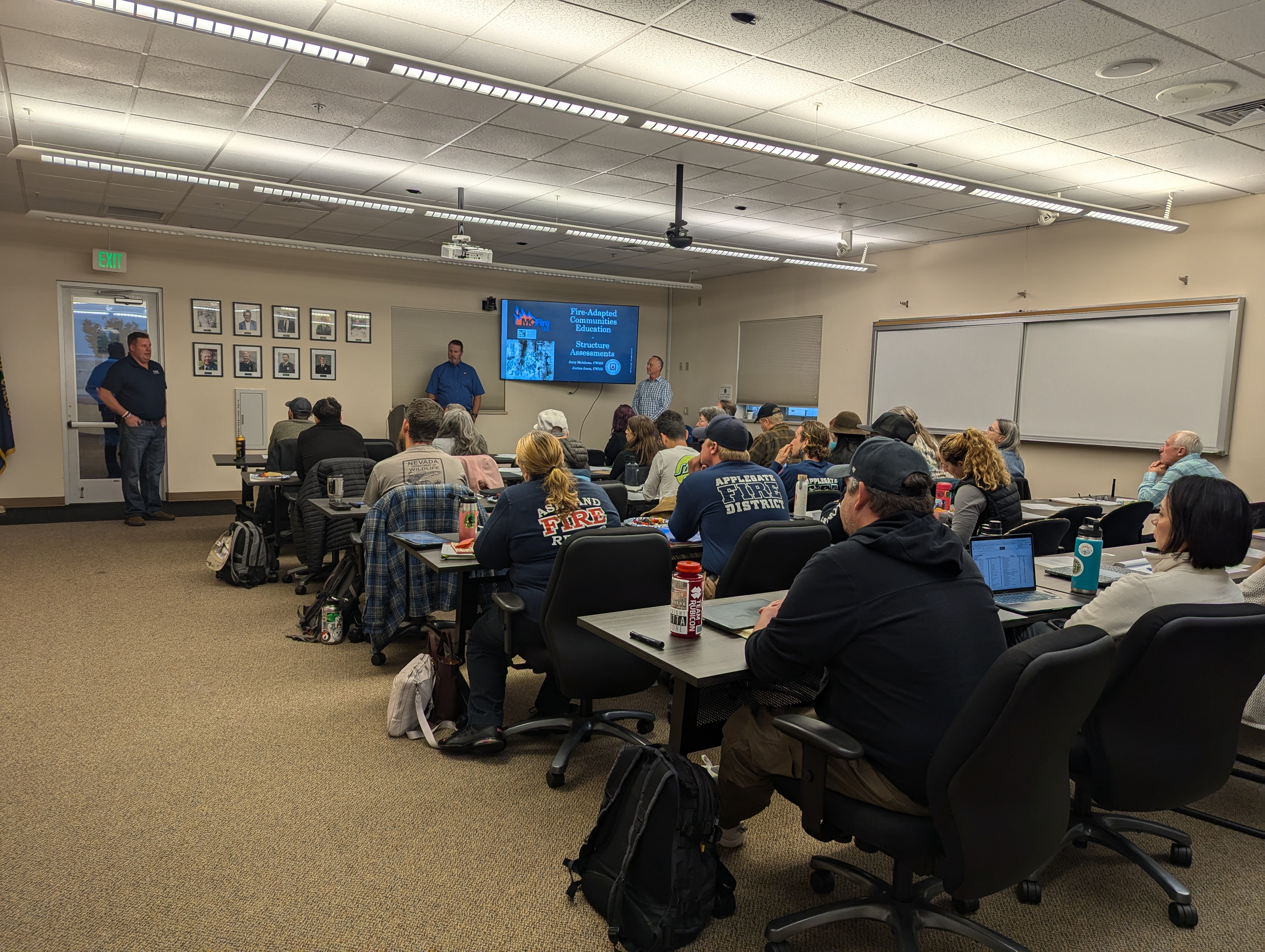 Image of classroom full of sitting students at 2-day MC Fire, LLC course in White City, Oregon, with Jerry McAdams teaching up front. Photo by August Pfau with the American Red Cross.