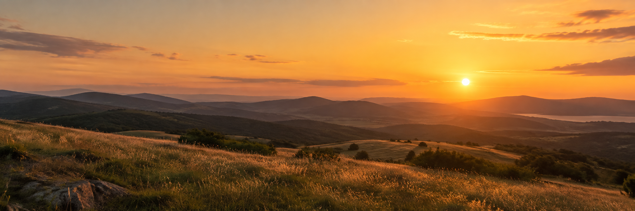 Golden hour sunset over rolling hills
