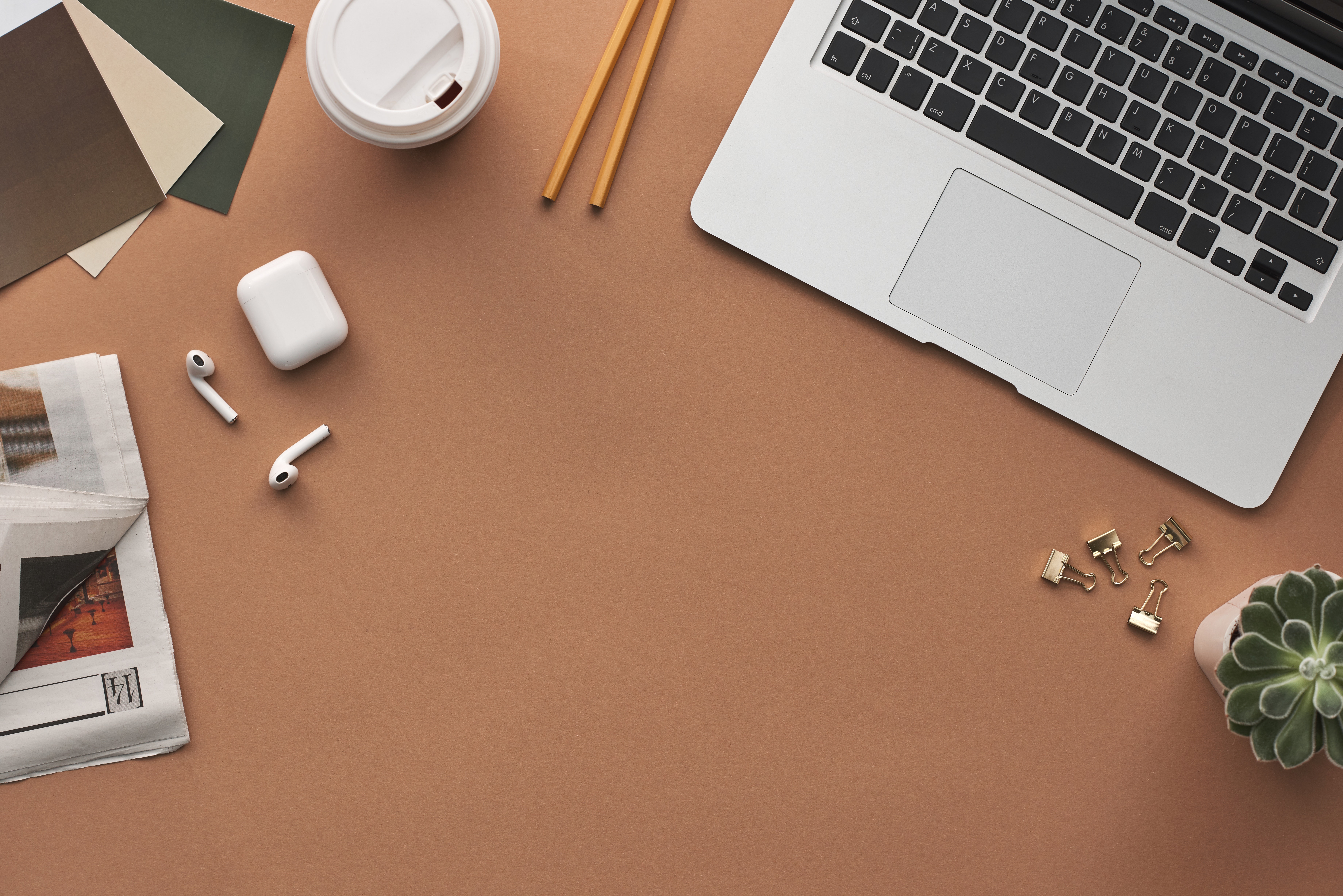 laptop on desk, note pad, pencils, social media, digital strategy