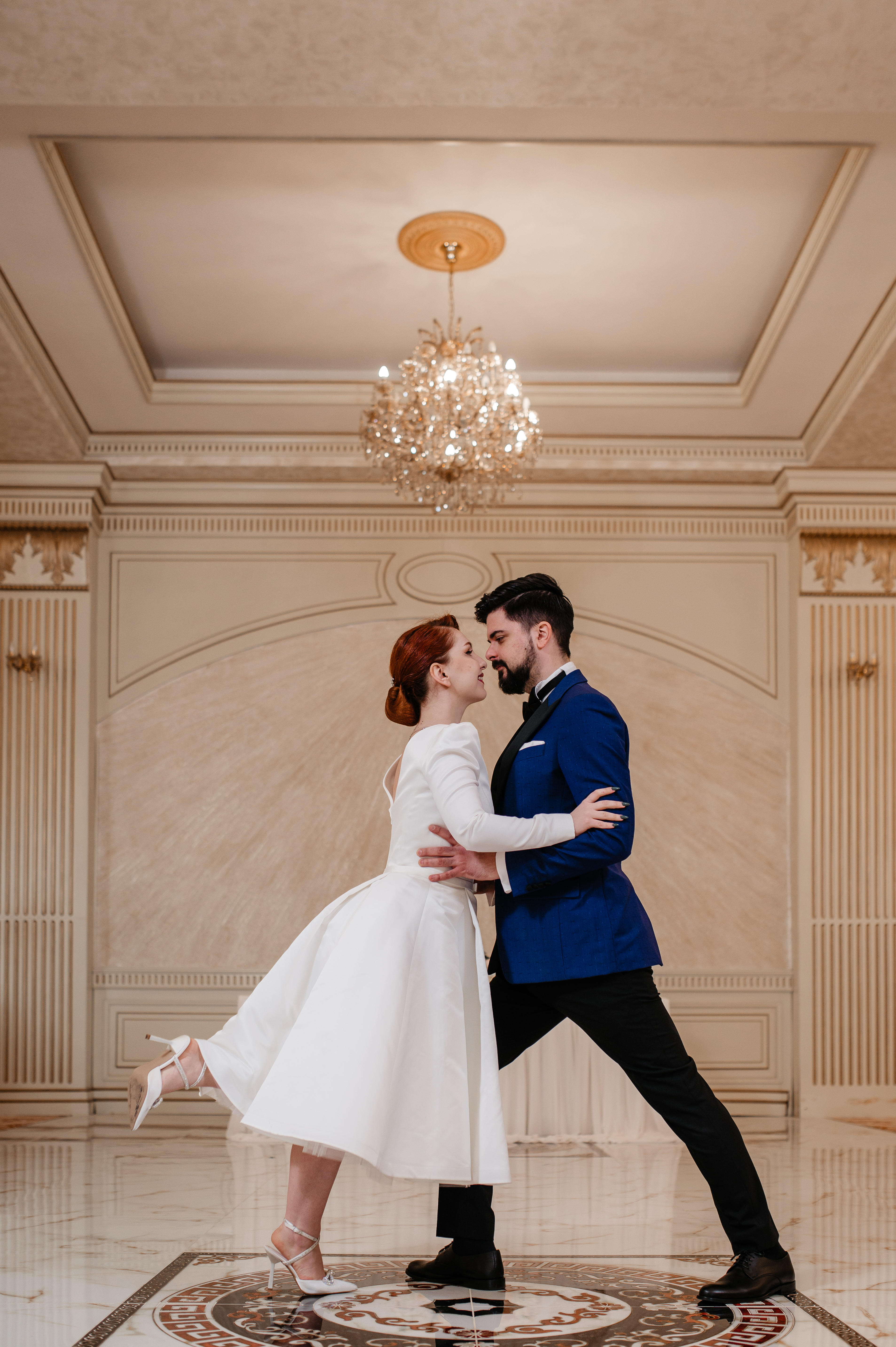 Ana and Andrew dancing in an elegant ballroom
