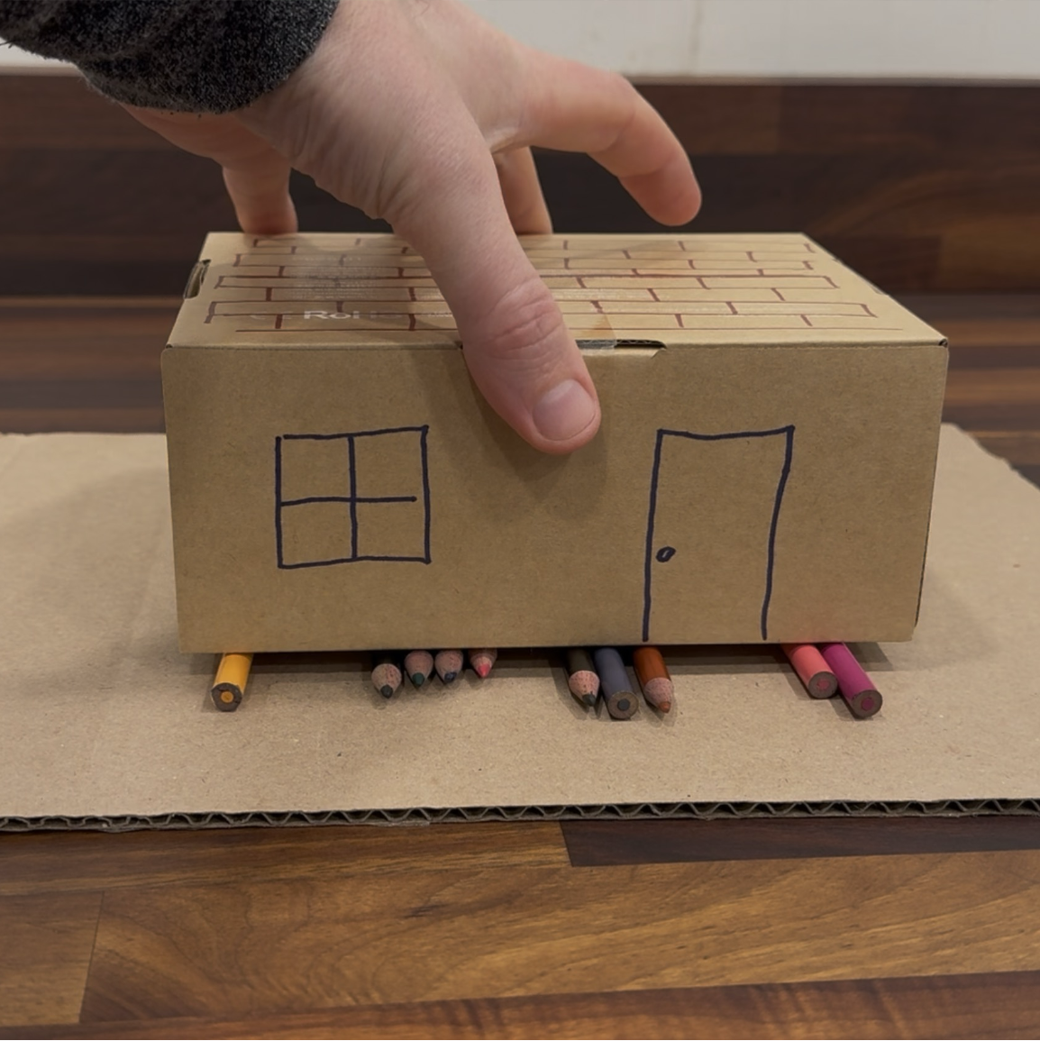 A box on rollers to simulate an earthquake
