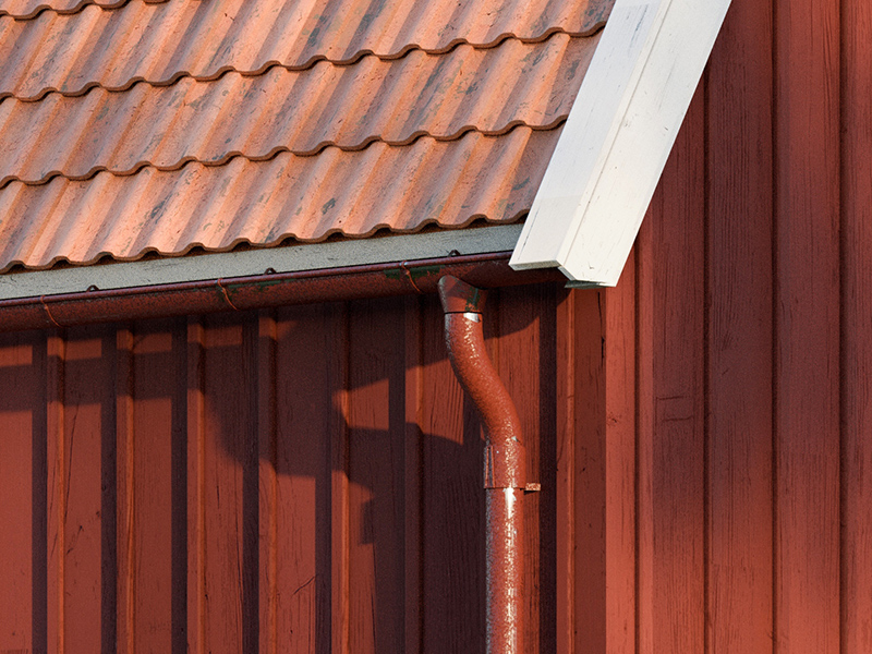 Material reference showing red timber cladding, terracotta roof tiles and a painted downpipe.