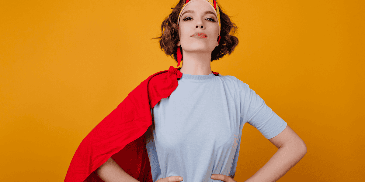 A woman has stopped revenge bedtime procrastination and is feeling powerful. She is dressed like a superhero.
