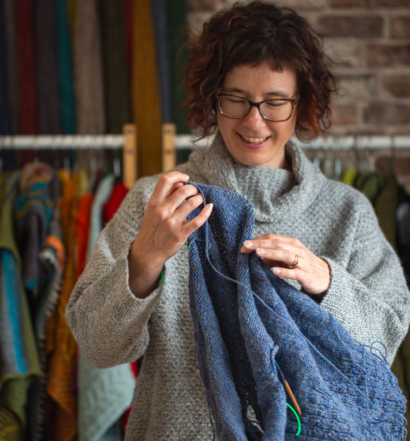 Carol Feller holding a knititng project.