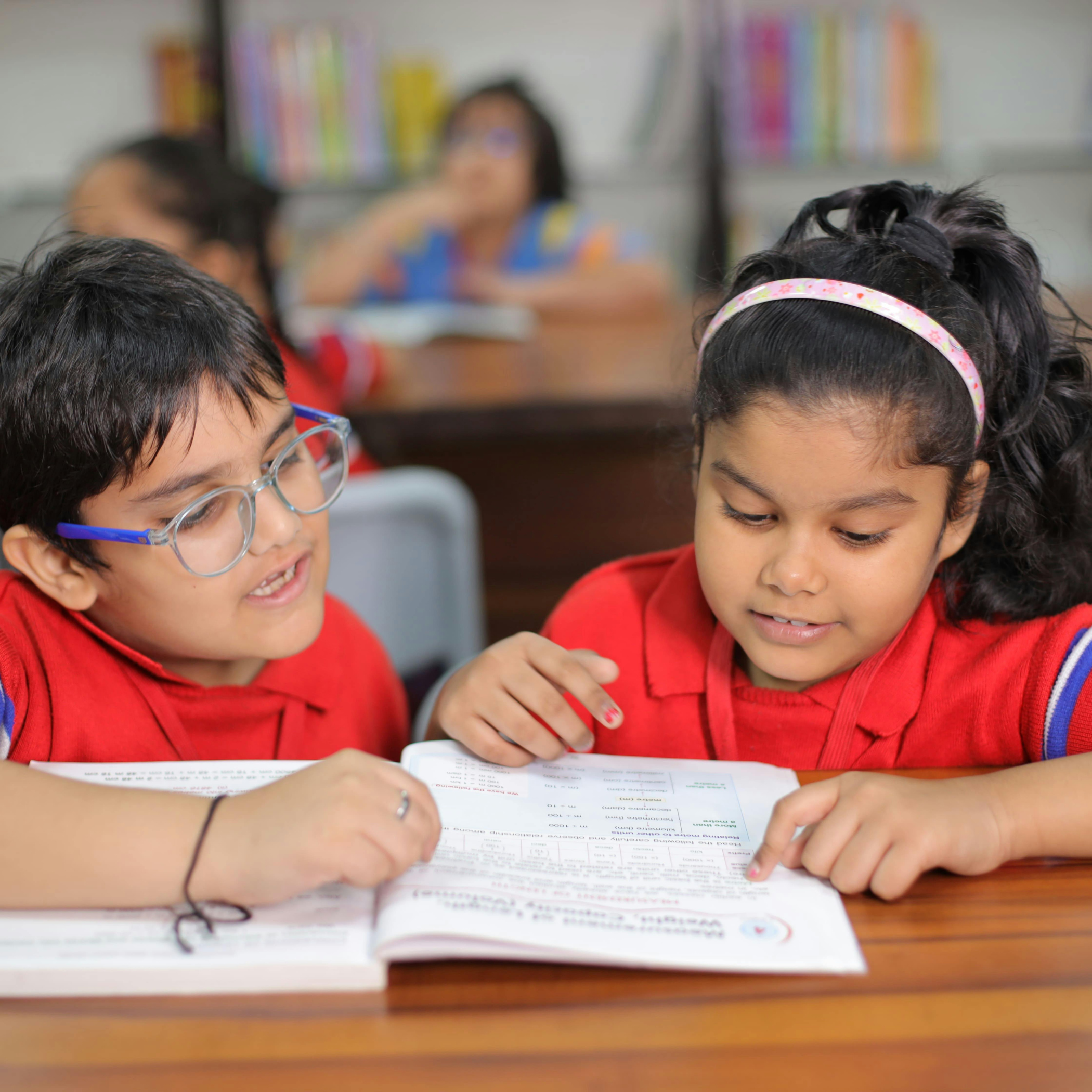 two children reading decorative