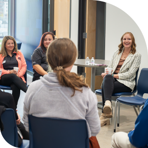 Six people sit in a circle for group training