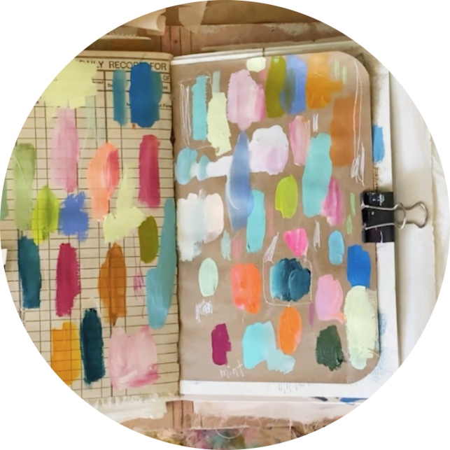 Colourful art journal page with layered paints and mixed-media techniques